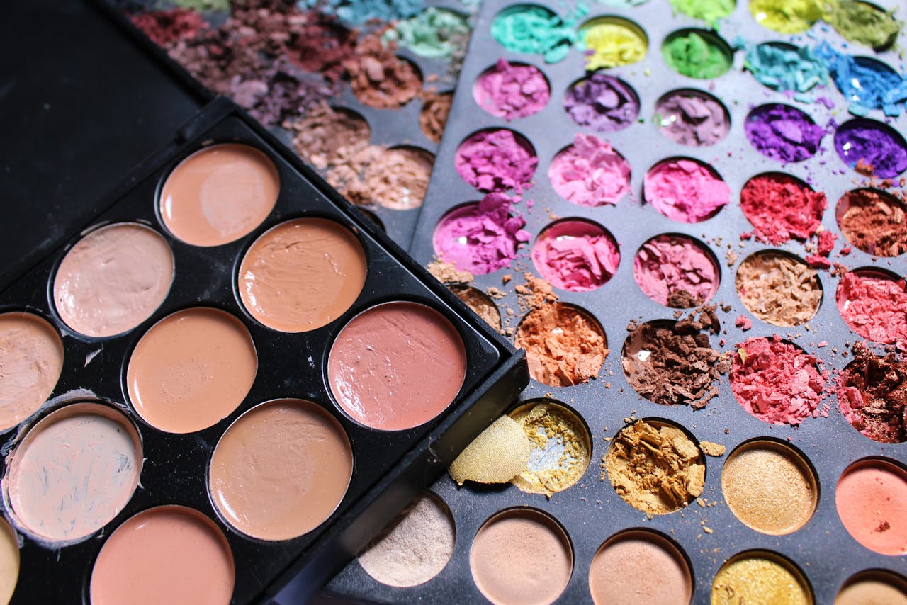 why-choose-us Close-up view of colorful makeup palettes with cracked pigments, ideal for beauty and cosmetics content.